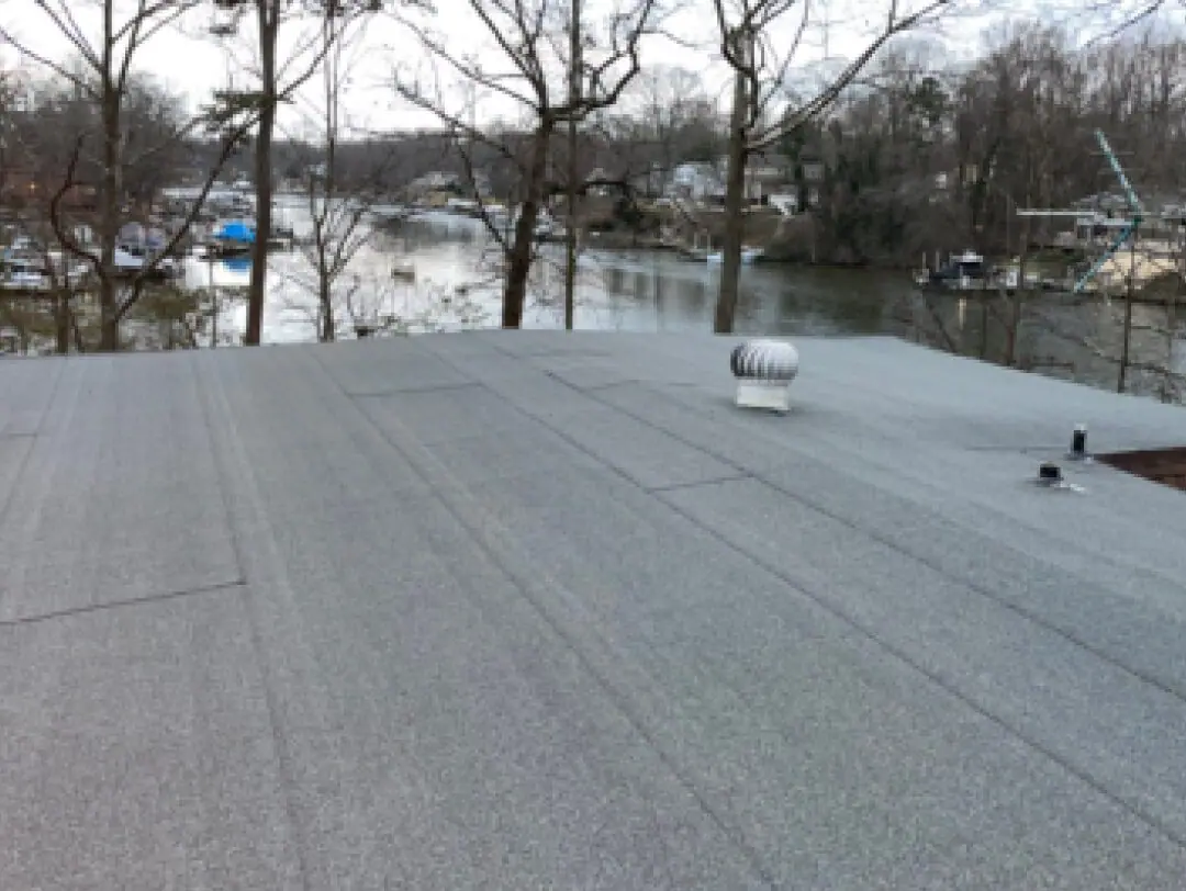 Flat roof with a new granulated modified-bitumen cap sheet and turbine vent