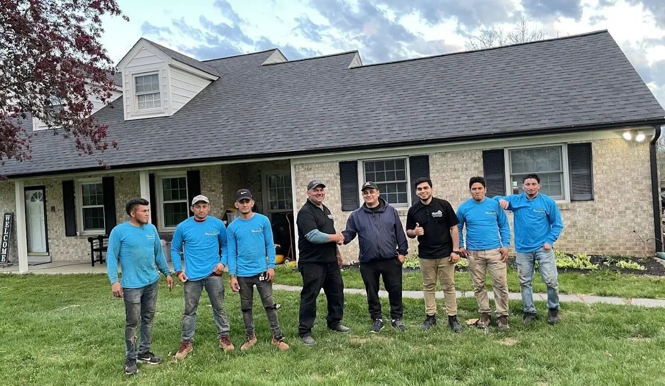 The Pineda's Roofing crew in front of a finished home in Maryland